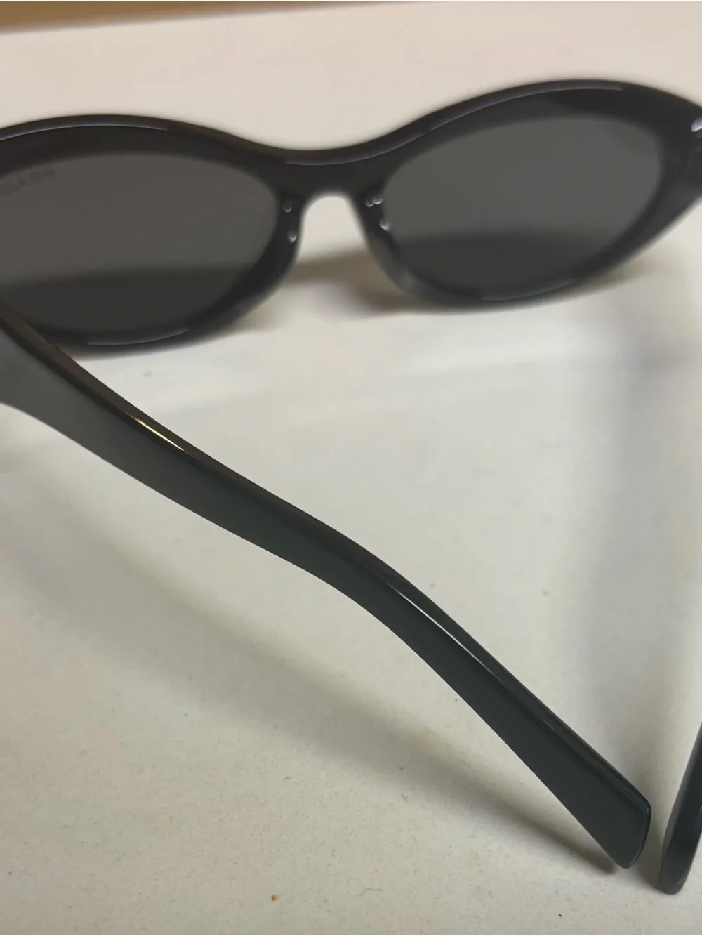 Prada Black Oval Women's Sunglasses